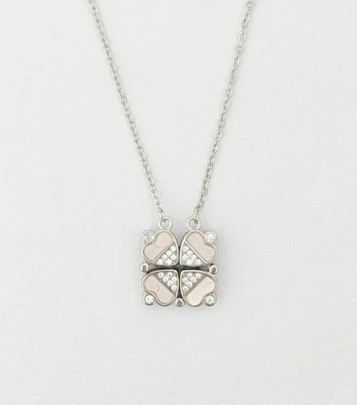 Butterfly-shaped pendant necklace on a light gray background